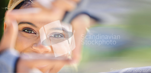 Image of Nature, portrait and frame hands of a woman for photography, creativity and an outdoor fun. Smile, closeup and face of young girl or with a gesture for picture in a park for creative aesthetic