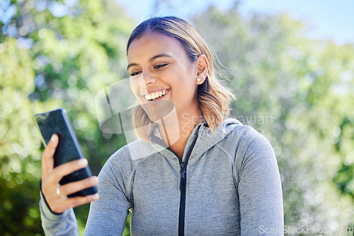 Image of Phone, laughing and a happy woman outdoor at a park with internet connection and communication. Young female person with a smartphone for reading chat, email or social media meme outdoor in nature