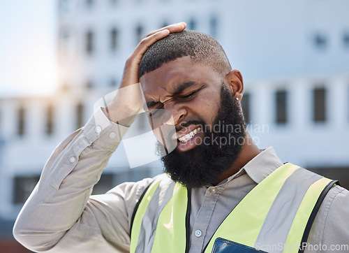 Image of Black man, architect and headache in city from stress, burnout or mistake on rooftop with pain in construction. African male person, engineer or contractor with mental health or migraine on site