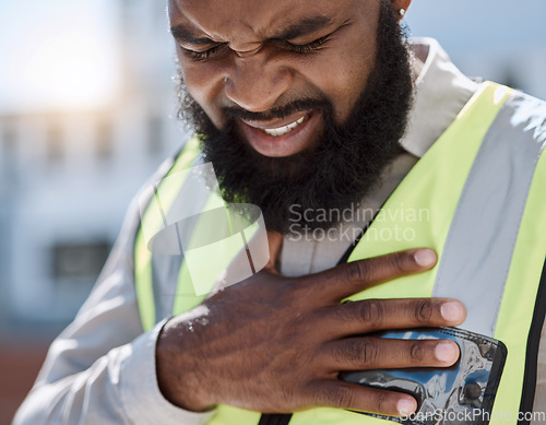 Image of Stress, construction worker and a black man with a heart attack in the city. Healthcare, burnout and an African builder, architect or handyman with anxiety, chest pain or medical emergency on site