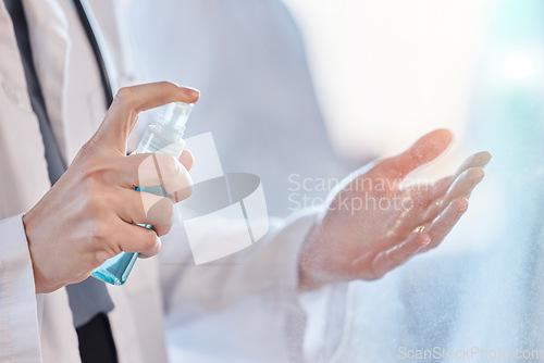 Image of Sanitizer, cleaning and hands of doctor with protection from bacteria or hygiene against virus at the workplace. Disease, closeup and professional medical employee or healthcare worker for wellness