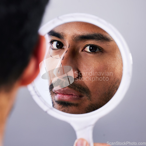 Image of Plastic surgery, mirror and drawing with facial of man and lines for rhinoplasty and nose. Skincare, face and dermatology of a male person with medical filler procedure and reflection in studio