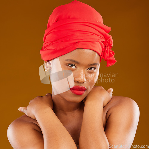 Image of Young beauty, wrap and portrait with scarf, red lipstick and girl wellness in studio. Yellow background, female person and self care cosmetics with model and makeup for skincare and facial glow