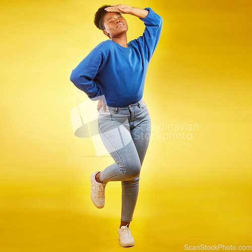 Image of Fashion, faint and young black woman in casual jeans for style or clothing isolated in a studio yellow background. Sad, tired and African person with natural beauty, confident and posing with drama