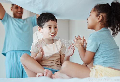 Image of Children, play and family with blanket at bed, bonding or smile together to relax. Applause, kids game and father in bedroom with sheet for patty cake, happy and enjoying quality time in house