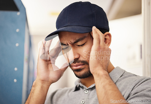 Image of Stress, courier and headache pain from delivery, logistics burnout and anxiety from a ecommerce. Depression, mental health and sad Asian worker or commercial worker with a migraine from shipping