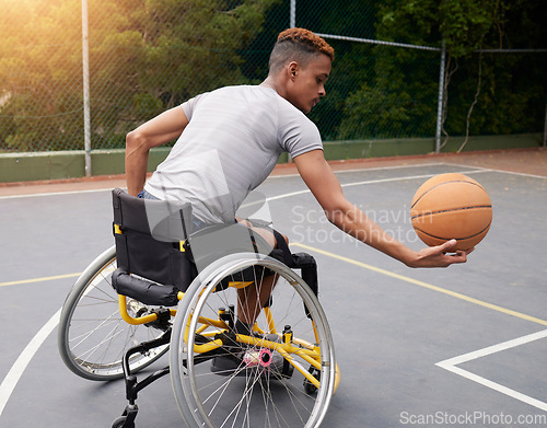 Image of Sports, basketball court and man in wheelchair for playing competition, challenge and practice outdoors. Fitness, wellness and male person with disability with ball for training, workout and exercise