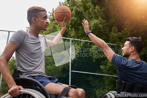 Image of Sports, basketball goal and men in wheelchair for playing competition, challenge and practice outdoors. Fitness, wellness and male people with disability with ball for training, workout and exercise