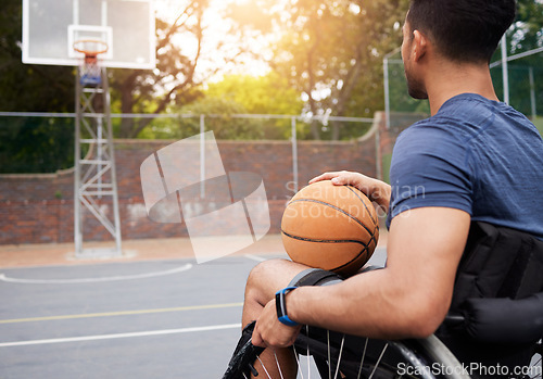 Image of Sports, basketball court and man focus in wheelchair for playing competition, games and shoot outdoors. Fitness, wellness and male person with disability with ball for training, workout and exercise