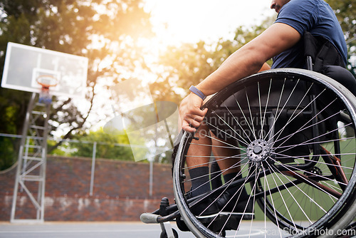 Image of Sports, basketball court and man in wheelchair for goal in competition, challenge and practice outdoors. Fitness, wellness and male person with disability with ball for training, workout and exercise