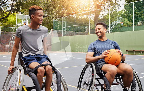 Image of Basketball player, men and team in wheelchair for sports break, rest and fitness on training court. People with a disability, athletes and happy with ball, mobility equipment and exercise workout