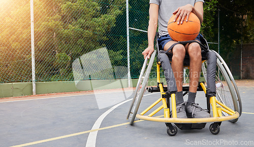 Image of Sports, basketball and man in wheelchair with ball for playing game, challenge and practice outdoors. Fitness mockup, wellness and male person with disability for training, workout and exercise