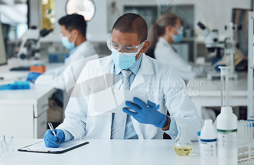 Image of Face mask man, tablet or writing in science laboratory for medical virus research, medicine or vaccine development. African scientist, technology or clipboard paper for healthcare and disease control