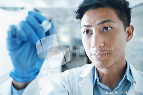 Image of Medical, science and writing with man in laboratory for idea, research and planning. Pharmacy, healthcare and medicine with Asian scientist and brainstorming for chemistry, solution and vaccine