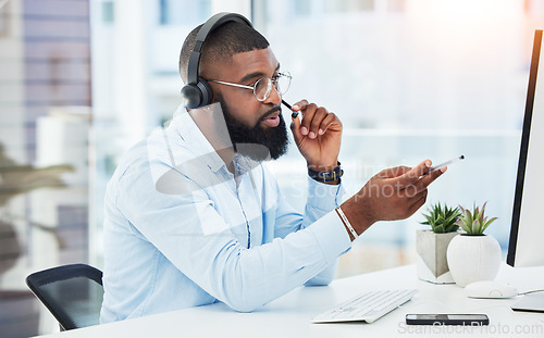 Image of Call center, customer service and consultant talking on call for insurance advice in an office for online telemarketing. Computer, contact us and man employee in discussion for sales or support