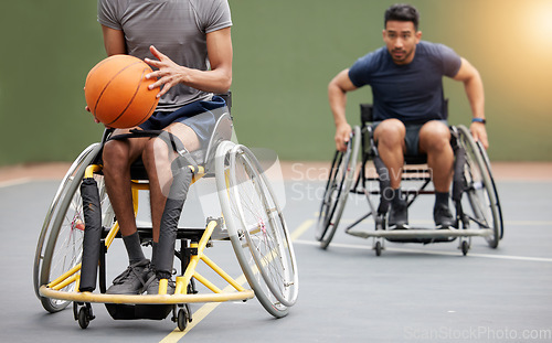 Image of Fitness, basketball and men in wheelchair on court for training, exercise and workout on outdoor park. Sports, team and male people with disability tackle for ball for competition, practice and games