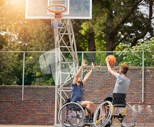 Image of Sports, wheelchair basketball shot and people practice target, goal or hoop shooting in match competition. Player aim ball, rival challenge and outdoor workout, fitness and athlete with disability