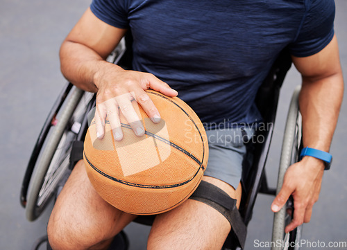 Image of Wheelchair, basketball and man hand with sports ball outdoor for fitness, training and cardio. Exercise, hobby and top view of male with disability ready for game, workout and fun or active match