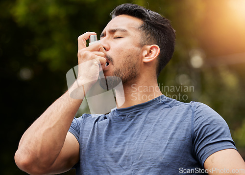 Image of Man, breathe or asthma pump outdoor in park for help with health risk, cough treatment and air for exercise. Asian male runner, spray and medicine inhaler in nature for lungs, oxygen and wellness
