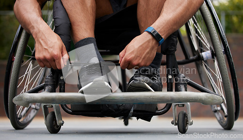 Image of Sports, wheelchair and hands tie shoes ready for training, exercise and workout on outdoor court. Fitness, start and person with disability tying sneakers for performance, wellness and challenge