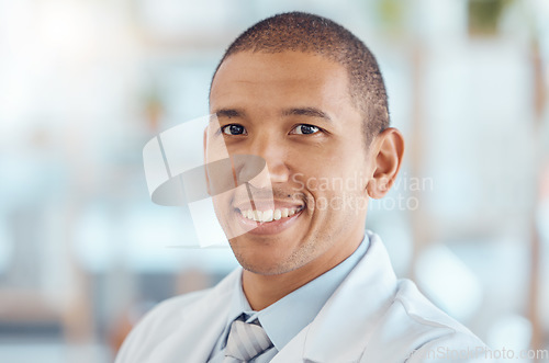 Image of Doctor, portrait and man with smile in office, healthcare and confidence at hospital with trust, support and help. Face of happy medical professional, expert in medicine and career in health care.