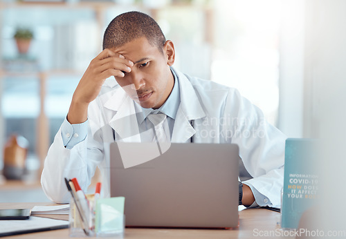 Image of Headache, doctor and man at laptop in medical office with burnout challenge, clinic problem and stress. Frustrated healthcare worker at computer with fatigue, migraine pain and anxiety of 404 mistake