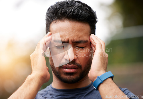 Image of Face of sports man, headache and pain outdoor for injury, vertigo and tired of exercise problem. Sad asian athlete, sick runner and training with migraine, fatigue or stress of burnout for fitness