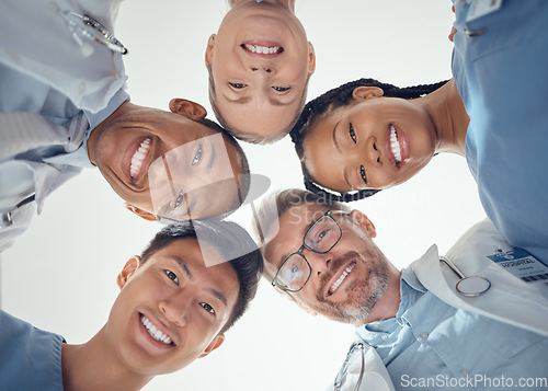 Image of Portrait, teamwork or doctors in huddle with a happy smile collaboration for healthcare goals together. Diversity, success or low angle of medical nurses with group support, motivation or mission