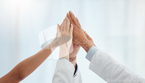 Image of Closeup, doctors and nurses in hospital high five hands for team building success, motivation or healthcare support. Diversity, medical and people in achievement, collaboration and winner celebration