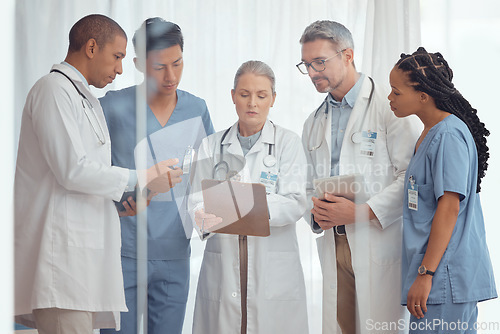 Image of Group of doctors, nurses and checklist in hospital, meeting and planning surgery or team schedule. Healthcare, discussion and medical staff with clipboard in consultation feedback together in clinic.