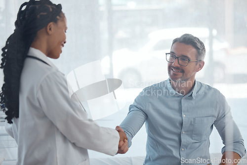 Image of Doctor consultation, patient and happy people handshake, wellness and hospital greeting, healthcare support or help. Agreement, happiness or medical surgeon hello, thank you or shaking hands with man