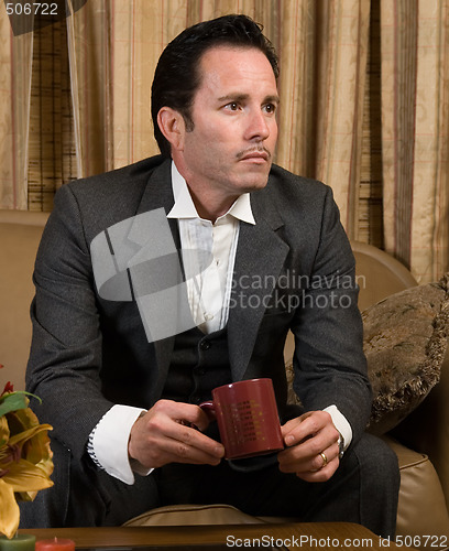 Image of Man having a cup of coffee