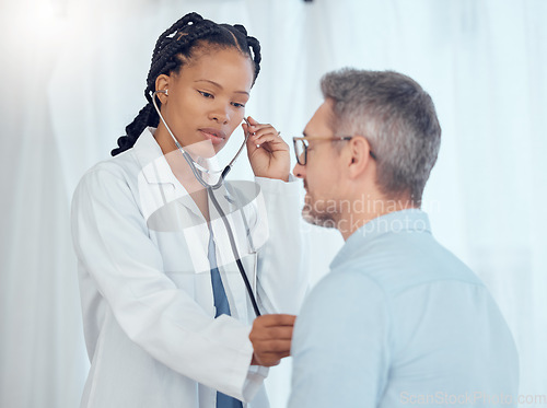 Image of Doctor, black woman listening with stethoscope to patient heartbeat, healthcare services and cardiology assessment in clinic. Medical worker check heart, lungs and breathing test of man in hospital