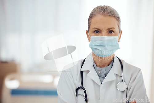 Image of Woman, portrait and doctor with face mask in hospital for medical services, surgery and mockup space. Serious female surgeon, senior therapist and healthcare manager with safety ppe working in clinic