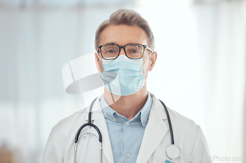 Image of Man, portrait and doctor with face mask in hospital for medical services, surgery and wellness consulting. Male surgeon, mature therapist and healthcare manager working with safety ppe in clinic
