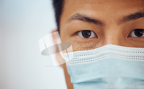 Image of Doctor, portrait and Asian man with mask, mockup banner and safety in healthcare in hospital on white background. Ppe, face and eyes of medical professional, rules and compliance work in clinic space