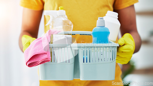 Image of Equipment, basket and hands of cleaner in a home for hygiene, germ protection and maintenance with a chemical. Bacteria, cleaning service and housekeeper or worker working in a house with gloves