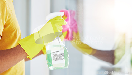 Image of Glass, spray and hands cleaning in a home for hygiene, germ protection and maintenance with a chemical in a house. Bacteria, service and housekeeper or cleaner working on a window with gloves