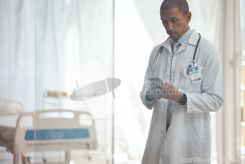 Image of Man, doctor and phone in hospital for medicine research, healthcare and prescription email in telehealth consulting. Serious, biracial person and medical worker on mobile technology for clinic help