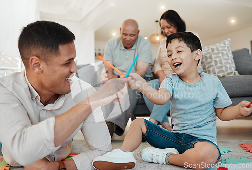 Image of Family, grandparents and father playing with child in a lounge floor in a home bonding for quality time together. Happy, love and dad with kid in a living room as a family with care and happiness