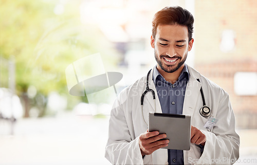 Image of Asian man, doctor and tablet with smile in hospital for planning, research and consulting on blurred background. Clinic, schedule and Japanese male health expert on app for Telehealth, help or advice