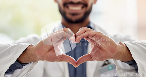 Image of Medical, wellness and doctor heart hands for love, support and healthcare in a hospital or clinic by medicine professional. Trust, hope and worker with bright sign, symbol or gesture for cardiology