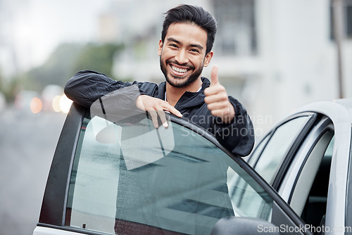 Image of New car, man with thumbs up and smile on street, yes and thank you for vehicle finance loan success. Winning, motor deal and happy driver in city for travel, transport and auto insurance agreement.