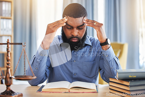 Image of Black man, lawyer and stress of headache in office with worry, pain and frustrated with challenge of court case in law firm. Confused advocate, tired attorney and fatigue from legal research analysis