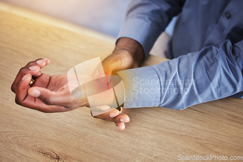 Image of Business person, wrist pain and red injury from osteoporosis, orthopedic joint and arthritis in office. Closeup, hands and worker with carpal tunnel, health risk and muscle fatigue of fibromyalgia