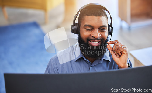 Image of Call center, customer support and black man on computer talking at desk for friendly service. Telemarketing, business and happy male consultant with headset for communication, crm help and contact