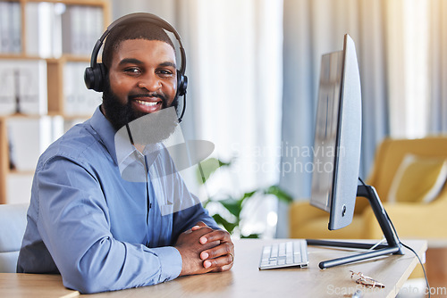 Image of Call center, customer support and portrait of black man at desk with smile for friendly service. Telemarketing, business and happy male consultant with headset for communication, crm help and contact