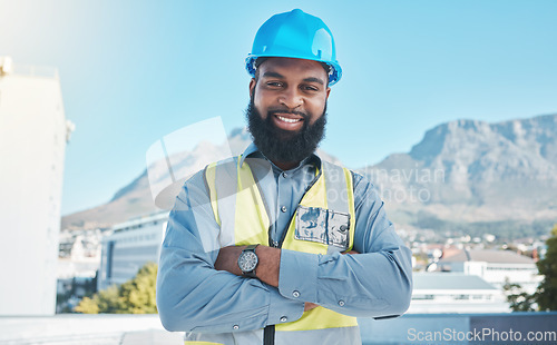 Image of Construction, portrait and black man in city with arms crossed for building project, site maintenance and civil engineering. Happy contractor, architecture and urban property development in Cape Town
