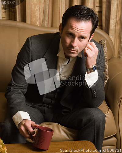 Image of Man having a cup of coffee