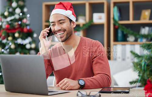 Image of Phone call, christmas hat and businessman in the office with a laptop on cellphone for communication. Happy, smile and male creative employee with xmas decorations on mobile conversation in workplace